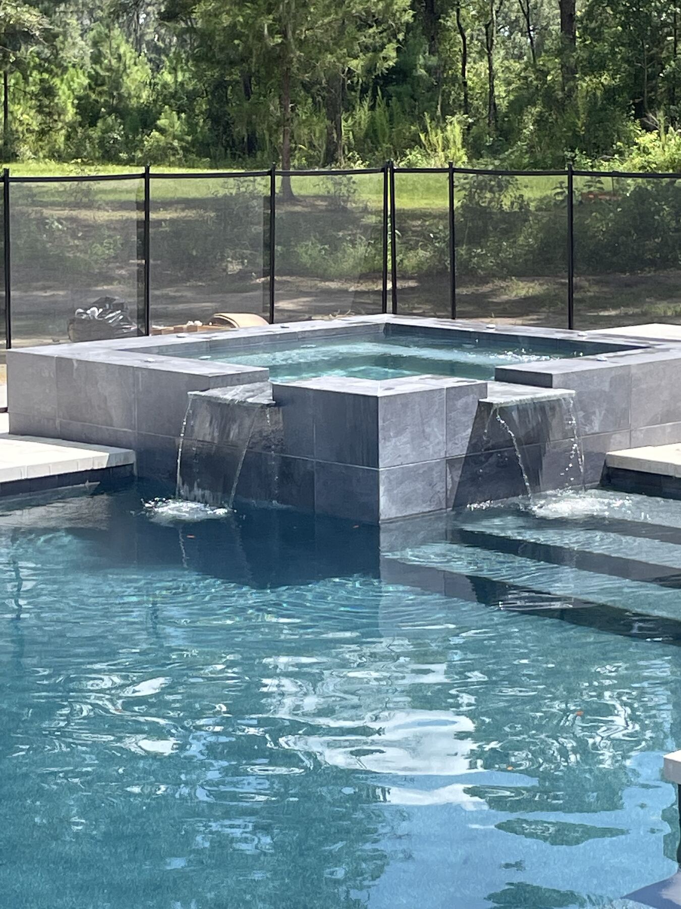 Custom spa with twin spillways built by Old Palm Pool Construction