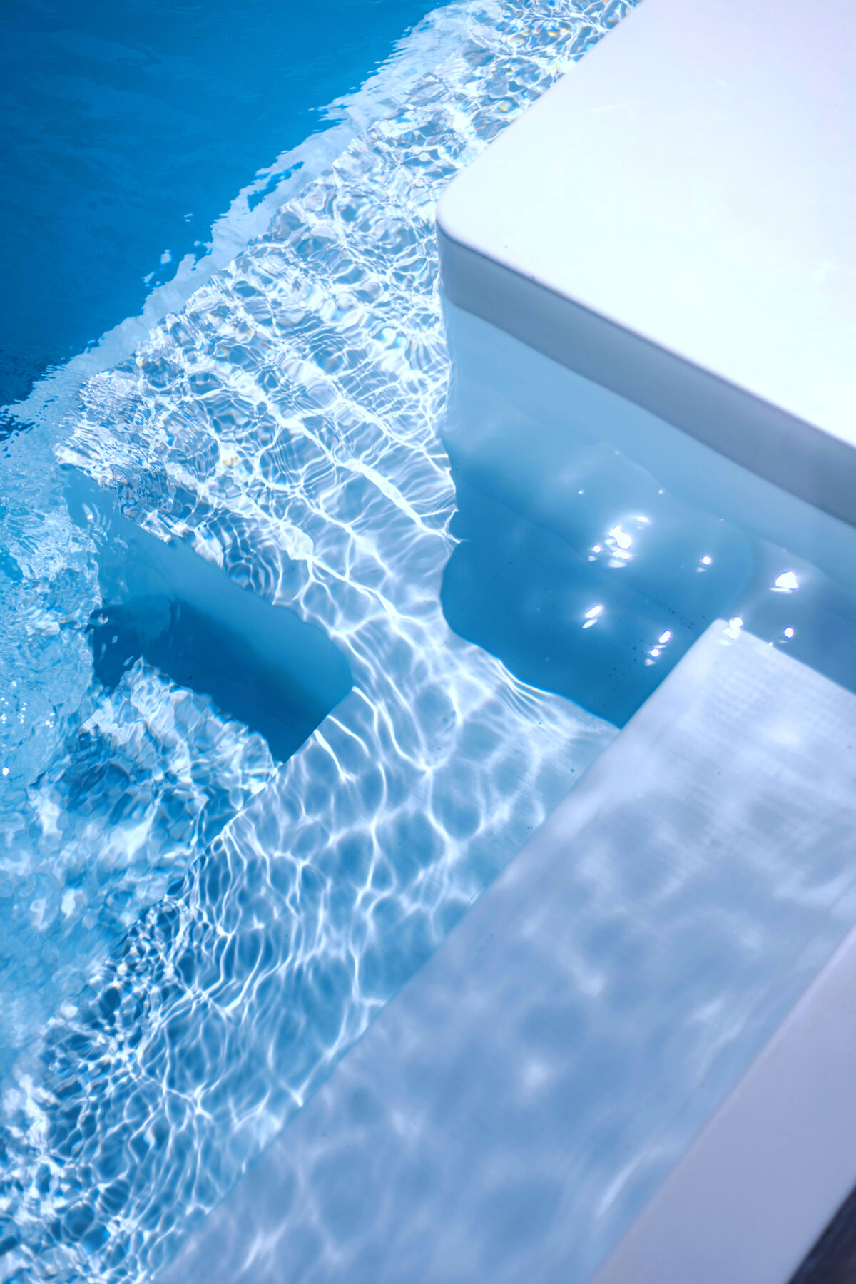 Crystal-clear water over a custom pool finish